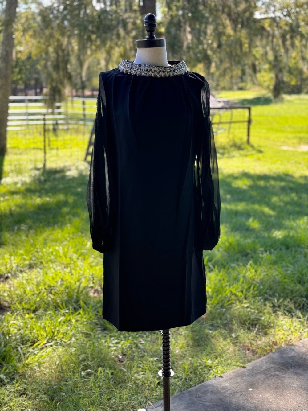 Black Long-Sleeve Cocktail Dress with Embellished Neckline
